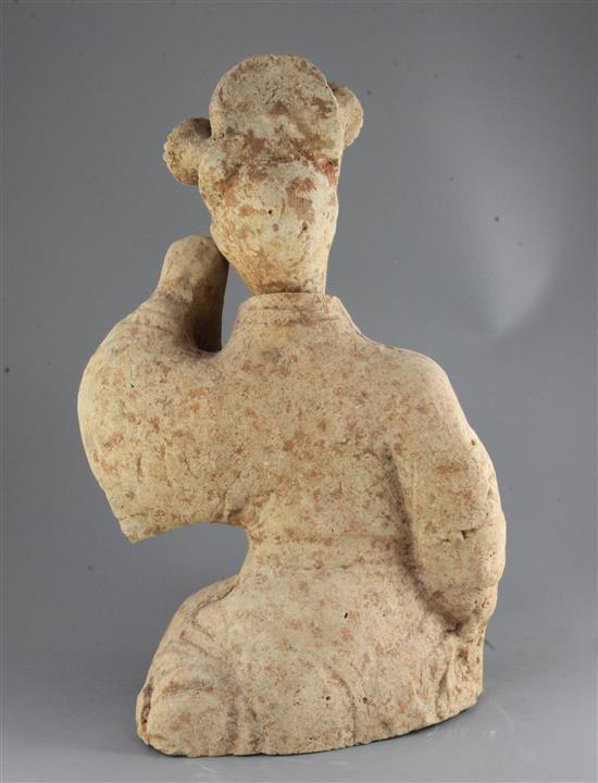 A large Chinese pottery figure of a seated entertainer, Eastern dynasty (25-220AD), 55.5cm